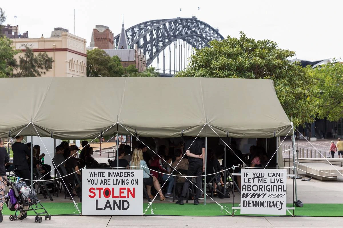 Richard Bell Embassy installation with Aboriginal flag and political text art in a gallery space