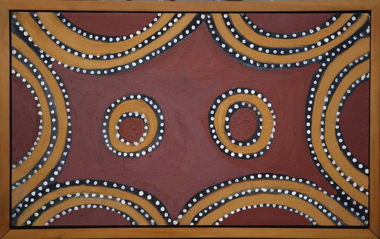 Contemporary Aboriginal painting showing the warm ochre tones of the desert landscape