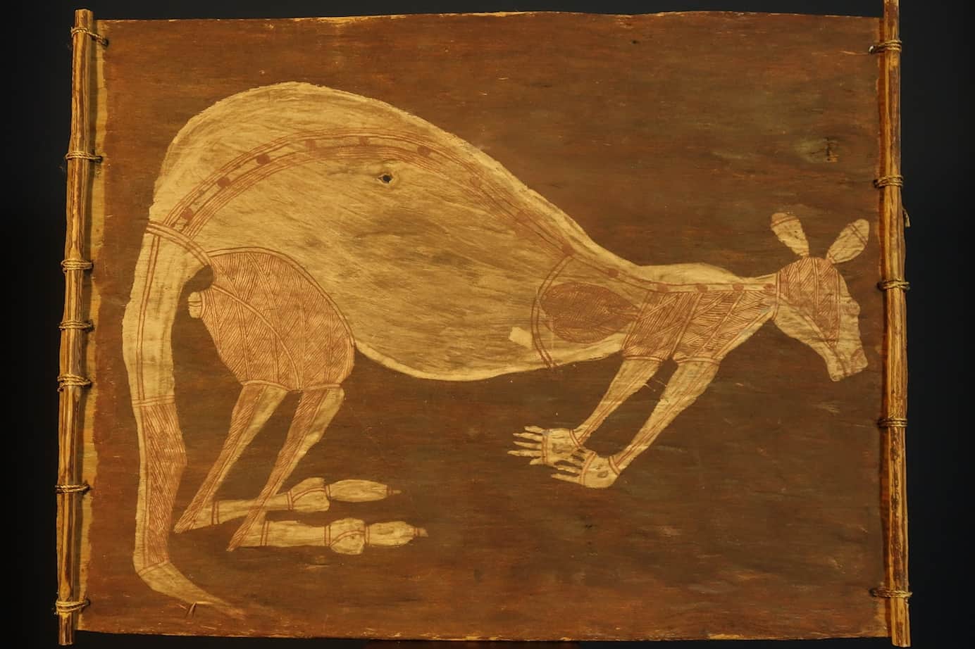 Aboriginal bark painting showing animals in traditional Arnhem Land style