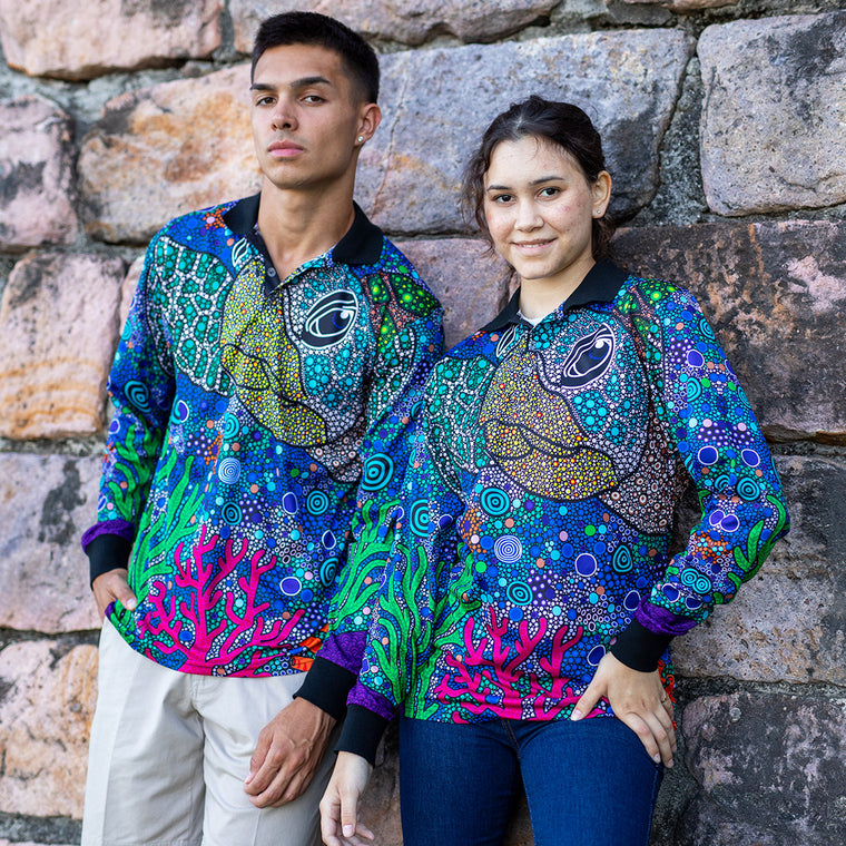 People wearing turtle-design Aboriginal art polo shirts