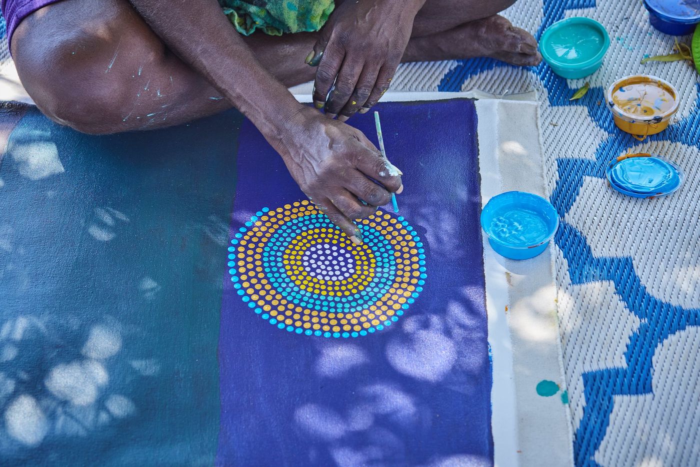 Bidyadanga artist Agnes Frank working out on country