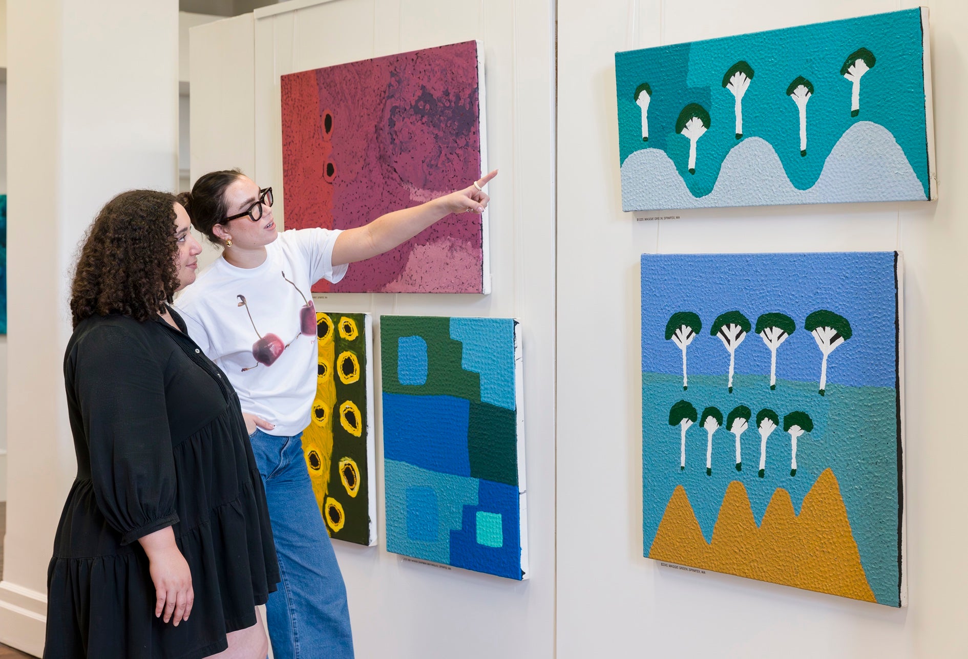 Aboriginal art centre artists at work on canvas