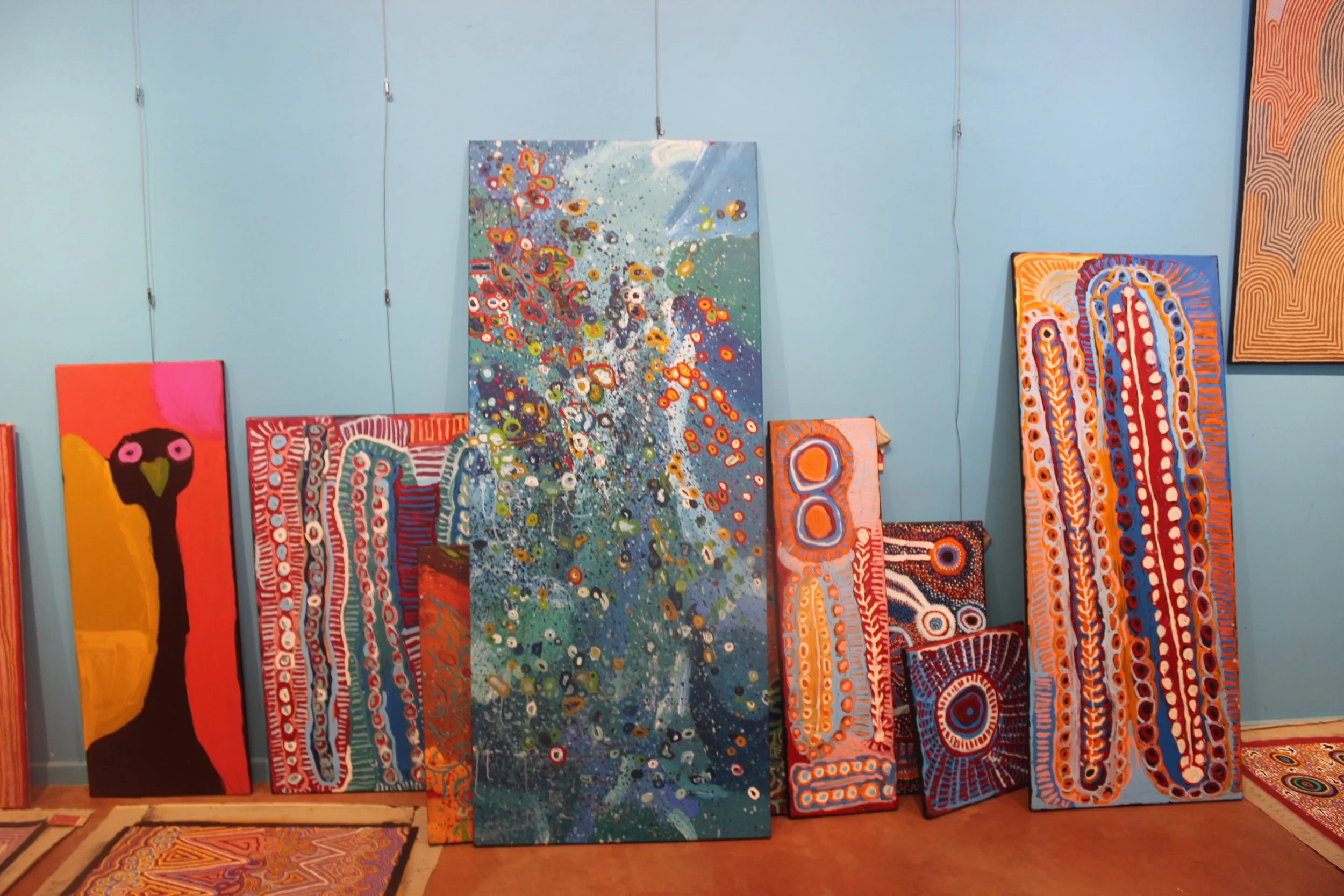 Contemporary Aboriginal paintings displayed in a home gallery setting