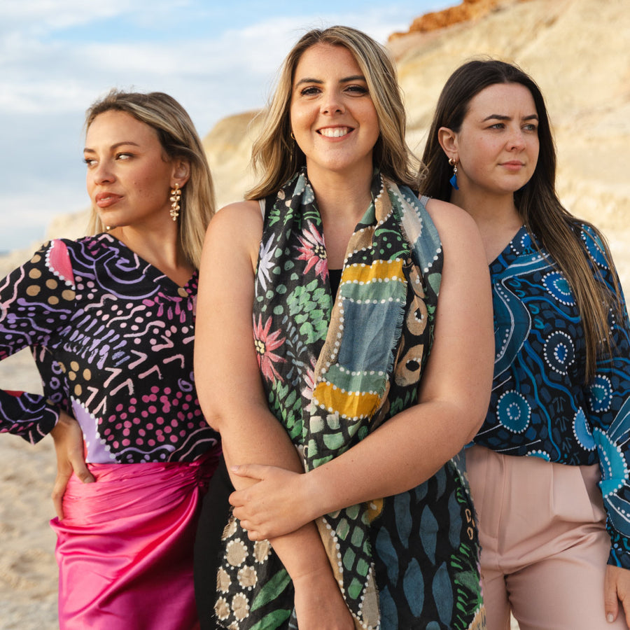 Solidarity at a public gathering showing Indigenous designed clothing