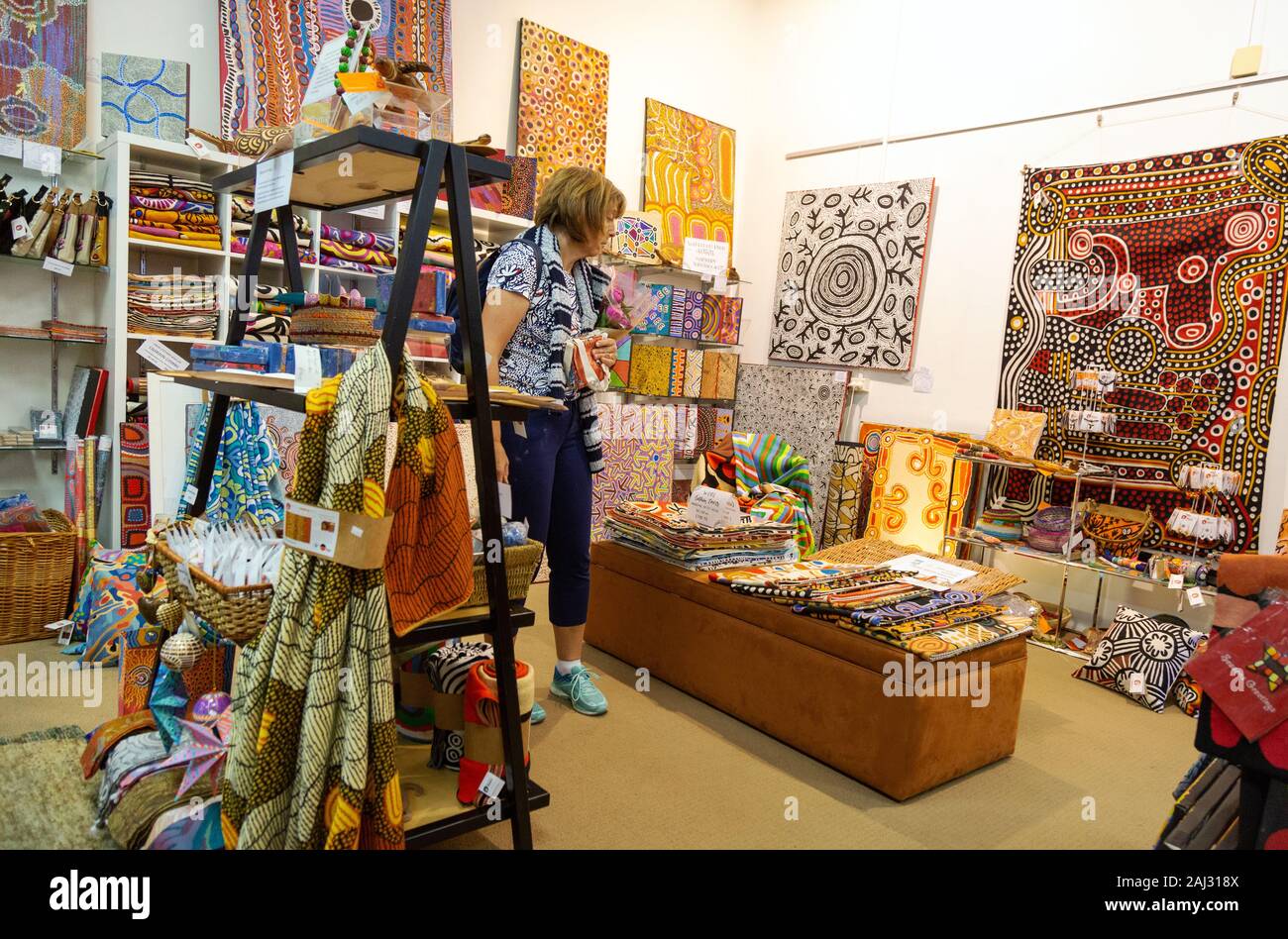 Woman shopping at an Aboriginal art store in Adelaide, Australia