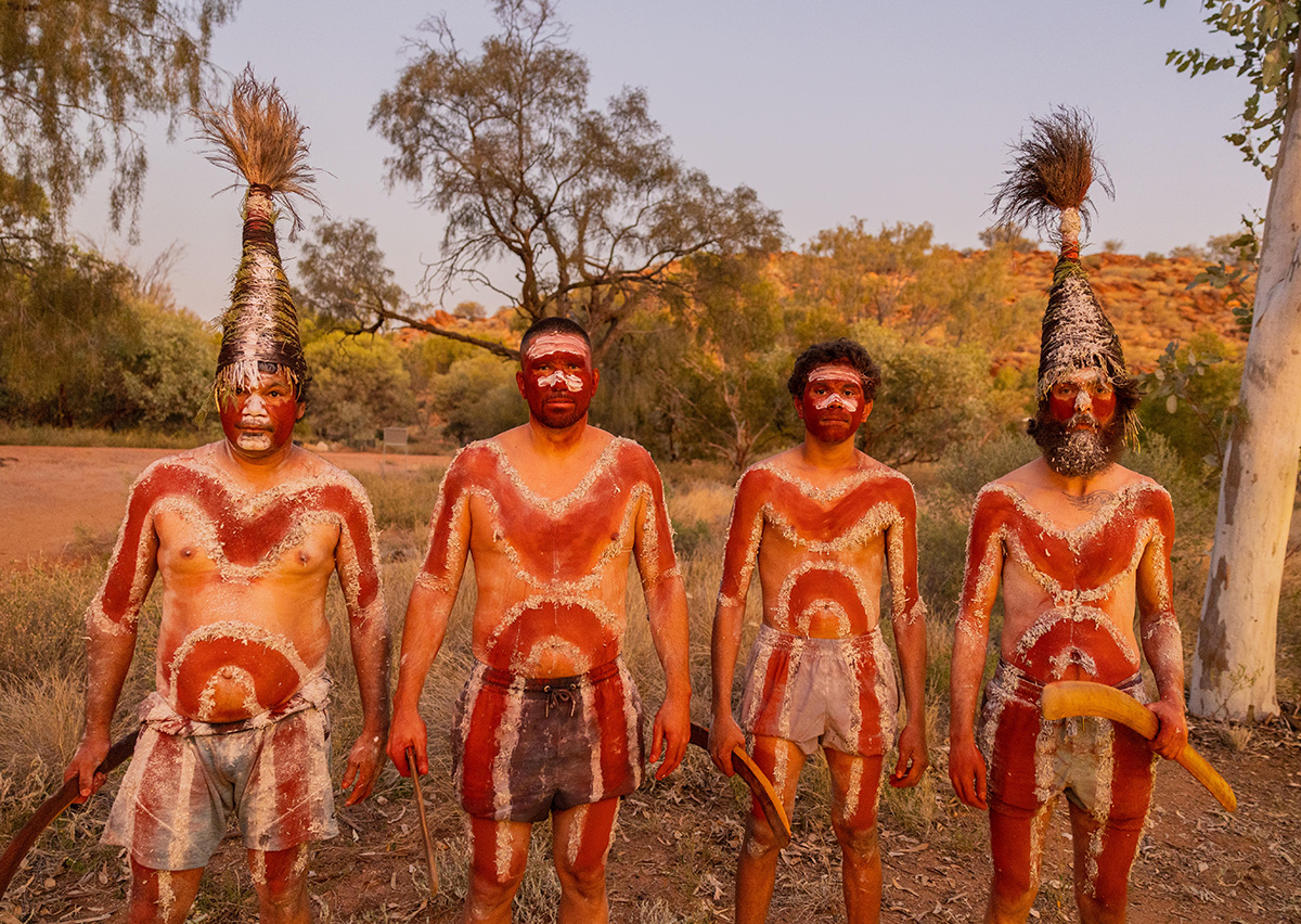 Aboriginal artist working on a dot painting