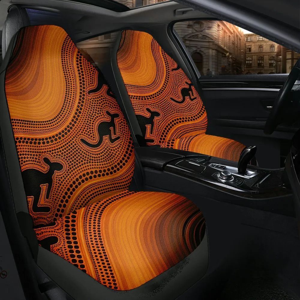 Orange kangaroo dot-painting Aboriginal car seat covers fitted in a vehicle