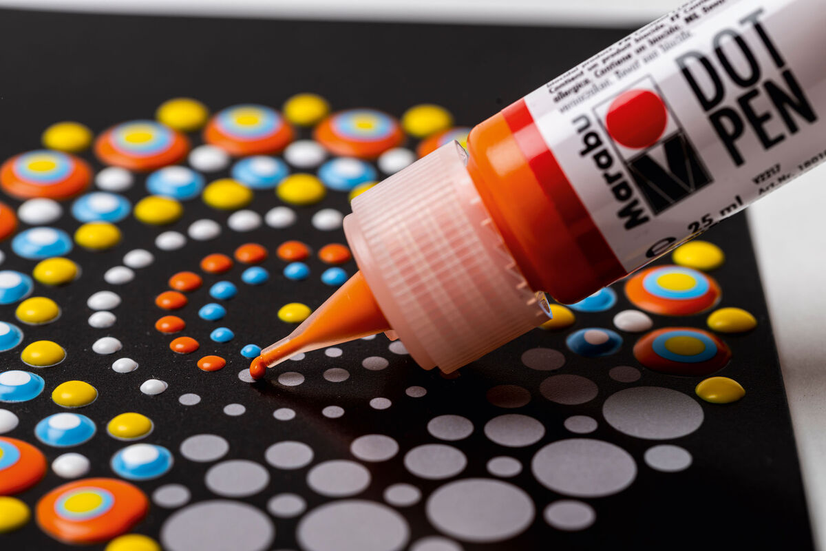 Dot painting supplies including paints and canvas
