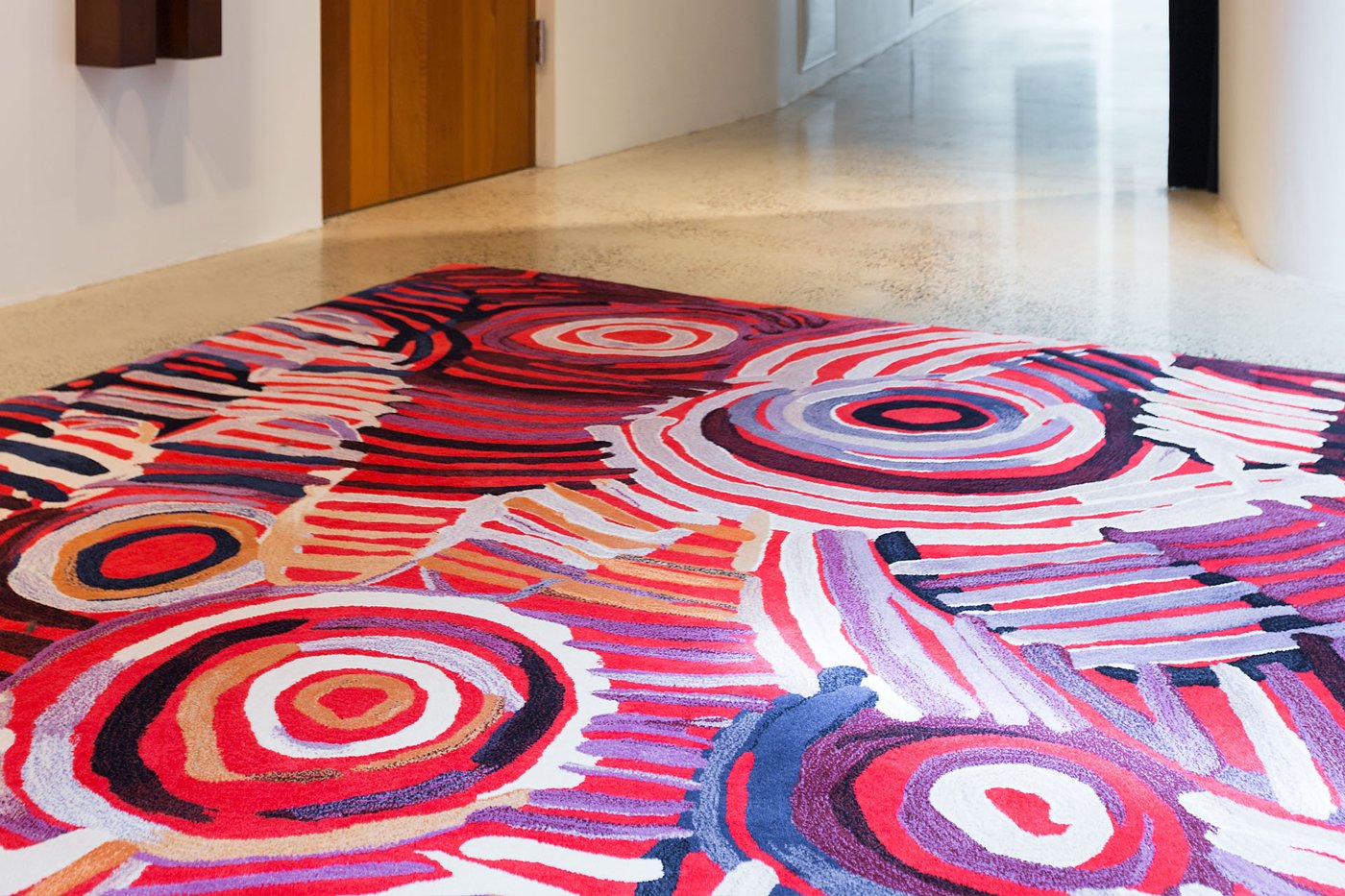 Indigenous Celebration designer rug by Minnie Pwerle photographed overhead