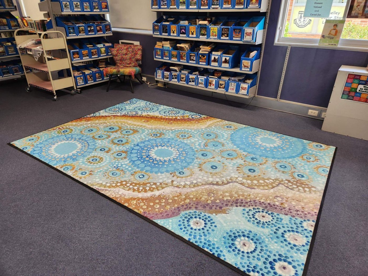 River Country Indigenous mat used in a library reading space